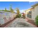Small, paved backyard with landscaping and a fence at 17090 Se 76Th Caledonia Ter, The Villages, FL 32162