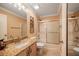 Clean bathroom with granite countertop, tub, and shower at 17090 Se 76Th Caledonia Ter, The Villages, FL 32162