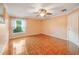 Bright bedroom featuring tile floors and a window at 17090 Se 76Th Caledonia Ter, The Villages, FL 32162