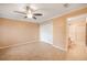 Bedroom with tile floors, ceiling fan and bathroom access at 17090 Se 76Th Caledonia Ter, The Villages, FL 32162
