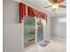 Room with sliding glass doors leading to backyard at 17090 Se 76Th Caledonia Ter, The Villages, FL 32162