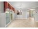 Bright dining room with tile floors and view to kitchen at 17090 Se 76Th Caledonia Ter, The Villages, FL 32162
