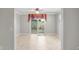 Dining area with sliding glass doors and tile floor at 17090 Se 76Th Caledonia Ter, The Villages, FL 32162