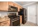 Stainless steel appliances and granite countertops in kitchen at 17090 Se 76Th Caledonia Ter, The Villages, FL 32162