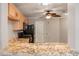 Kitchen boasts granite countertops and stainless steel appliances at 17090 Se 76Th Caledonia Ter, The Villages, FL 32162