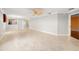 Large living room with tile floors and access to kitchen at 17090 Se 76Th Caledonia Ter, The Villages, FL 32162
