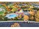 Resort-style pool with clubhouse and surrounding landscape at 17090 Se 76Th Caledonia Ter, The Villages, FL 32162