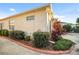 Landscaped side yard with a walkway and fence at 17090 Se 76Th Caledonia Ter, The Villages, FL 32162