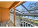 Large screened balcony overlooking the pool, spa, and lake at 2024 Capri Ln, Mount Dora, FL 32757