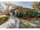 Landscaped entryway with a curving walkway leading to the front door at 6241 Elm W Sq, Lakeland, FL 33813