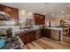 Modern kitchen with dark wood cabinets, granite countertops and stainless steel appliances at 6241 Elm W Sq, Lakeland, FL 33813