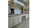 Double vanity bathroom with a large mirror at 3323 Songbird Ln, Lakeland, FL 33811