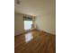 Spacious bedroom with wood floors and a bed frame at 3323 Songbird Ln, Lakeland, FL 33811