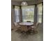 Eat-in kitchen area with corner window and four chairs at 3323 Songbird Ln, Lakeland, FL 33811