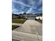 Front view of a single-story house with a two-car garage at 3323 Songbird Ln, Lakeland, FL 33811