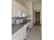 Bright kitchen with white cabinets and gas range at 3323 Songbird Ln, Lakeland, FL 33811