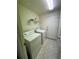 Laundry room with washer, dryer, and shelving at 3323 Songbird Ln, Lakeland, FL 33811