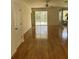 Spacious living room with laminate wood floors and sliding glass doors at 3323 Songbird Ln, Lakeland, FL 33811