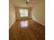 Spacious living room with wood floors and ceiling fan at 3323 Songbird Ln, Lakeland, FL 33811