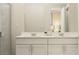 Modern bathroom with double vanity and a walk-in shower at 7009 Rosy Sky Ave, Orlando, FL 32829