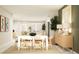 Open concept dining area with light wood furniture at 7009 Rosy Sky Ave, Orlando, FL 32829