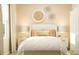 Bright bedroom with neutral decor and woven wall decor at 7013 Rosy Sky Ave, Orlando, FL 32829