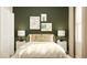 Bedroom with green accent wall and nature-inspired decor at 7013 Rosy Sky Ave, Orlando, FL 32829