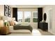 Spacious bedroom featuring a king bed, en-suite bathroom access, and large windows at 7013 Rosy Sky Ave, Orlando, FL 32829