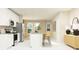 Modern kitchen with white cabinets, island, and stainless steel appliances at 7013 Rosy Sky Ave, Orlando, FL 32829