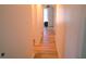 Long hallway with light wood laminate flooring at 169 Vista View Ave, Eagle Lake, FL 33839
