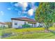 Landscaped backyard with lush lawn and large tree at 1369 Palmetto Dunes St, Davenport, FL 33896