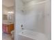 Clean bathroom with a shower/tub combo and wood vanity at 1369 Palmetto Dunes St, Davenport, FL 33896