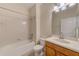 Bathroom featuring a tub, wood vanity, and tile flooring at 1369 Palmetto Dunes St, Davenport, FL 33896