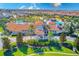 Community clubhouse with a tiled roof and palm trees at 1369 Palmetto Dunes St, Davenport, FL 33896