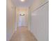 Bright entryway with tile flooring and coat closet at 1369 Palmetto Dunes St, Davenport, FL 33896
