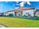 House exterior with a backyard and patio at 1369 Palmetto Dunes St, Davenport, FL 33896