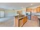 Kitchen with island, granite countertops, and stainless steel appliances at 1369 Palmetto Dunes St, Davenport, FL 33896