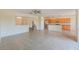 Open kitchen with wood cabinets, granite counters, and stainless steel appliances at 1369 Palmetto Dunes St, Davenport, FL 33896