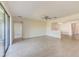 Bright living room with tile floors and access to sliding doors at 1369 Palmetto Dunes St, Davenport, FL 33896