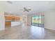 Open living area with kitchen views and backyard access at 1369 Palmetto Dunes St, Davenport, FL 33896