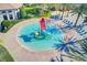 Circular splash pad with small water features for children at 1369 Palmetto Dunes St, Davenport, FL 33896