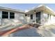 Front view of house with gray door and landscaping at 4706 Kimball W Ct, Lakeland, FL 33813