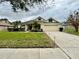 Attractive single-story residence featuring a two-car garage and well-maintained landscaping at 506 Alleria Ct, Auburndale, FL 33823