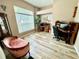 Home office or den with large window and wood-look flooring at 506 Alleria Ct, Auburndale, FL 33823