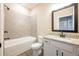 Well-appointed bathroom with a bathtub, tiled shower walls, and a granite vanity at 7837 Somersworth Dr, Kissimmee, FL 34747
