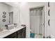 Contemporary bathroom featuring a double vanity, shower/tub, and tile flooring at 1767 Bee Nice Dr, Kissimmee, FL 34744