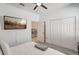 Relaxing bedroom with a wall-mounted TV, neutral decor, and carpeted flooring at 1767 Bee Nice Dr, Kissimmee, FL 34744
