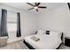 Modern bedroom with a comfortable bed, minimalist decor, and soft carpeting at 1767 Bee Nice Dr, Kissimmee, FL 34744