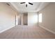 Spacious main bedroom with plush carpeting, tray ceiling, and an ensuite bathroom at 7861 Somersworth Dr, Kissimmee, FL 34747
