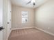 Cozy bedroom with plush carpeting, a window, and a neutral color palette at 7853 Somersworth Dr, Kissimmee, FL 34747